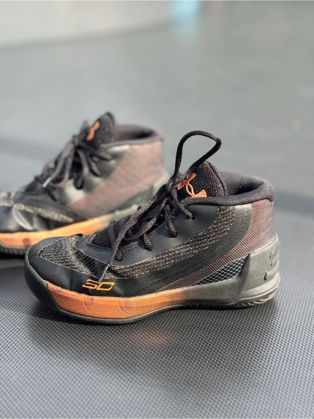 Under Armour Kids Black Sneakers with Orange Accents
